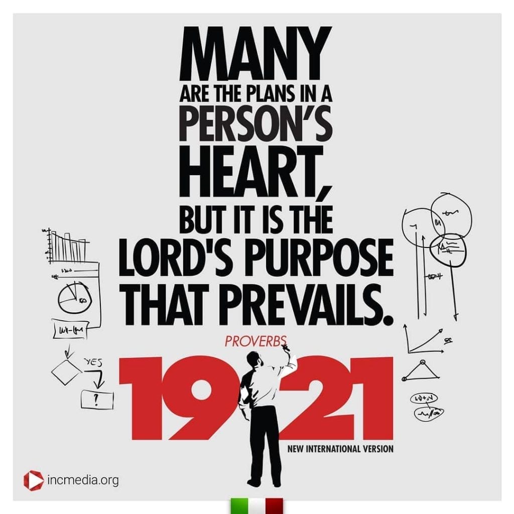 Proverbs 19:21 with man writing.