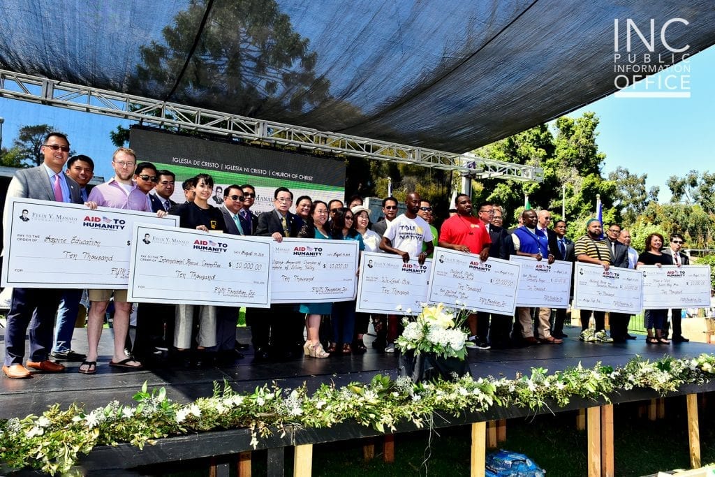 Brother Glicerio B. Santos, Jr, General Auditor of the INC and FYM Foundation Representative together with the representatives from eight local organizations from Oakland each receiving their $10,000 donation from the FYM Foundation.