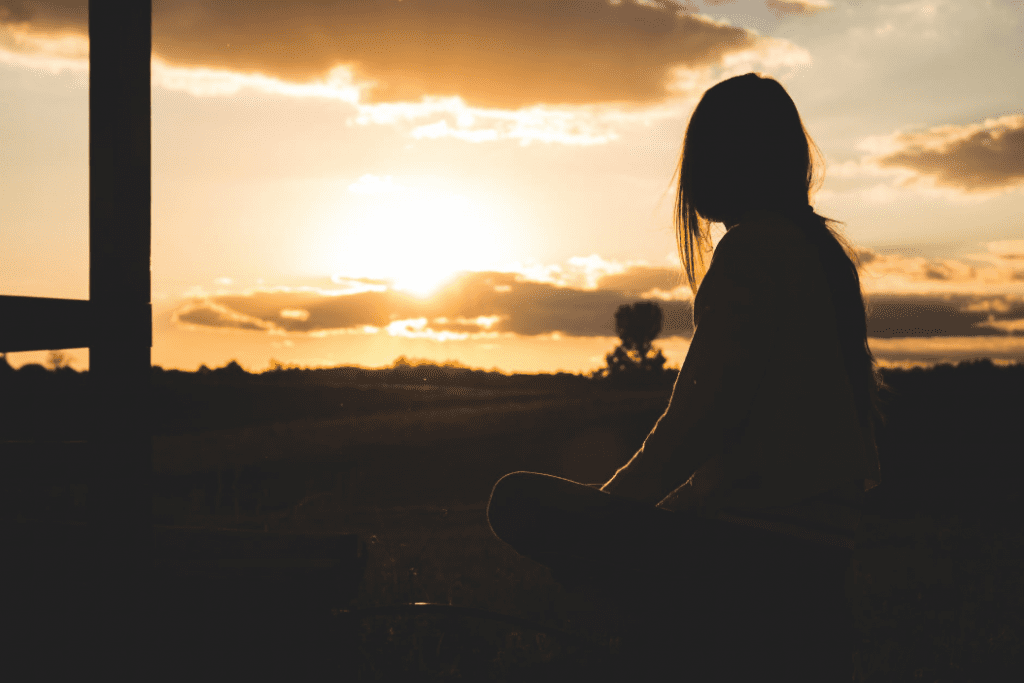 Woman looking at sunset